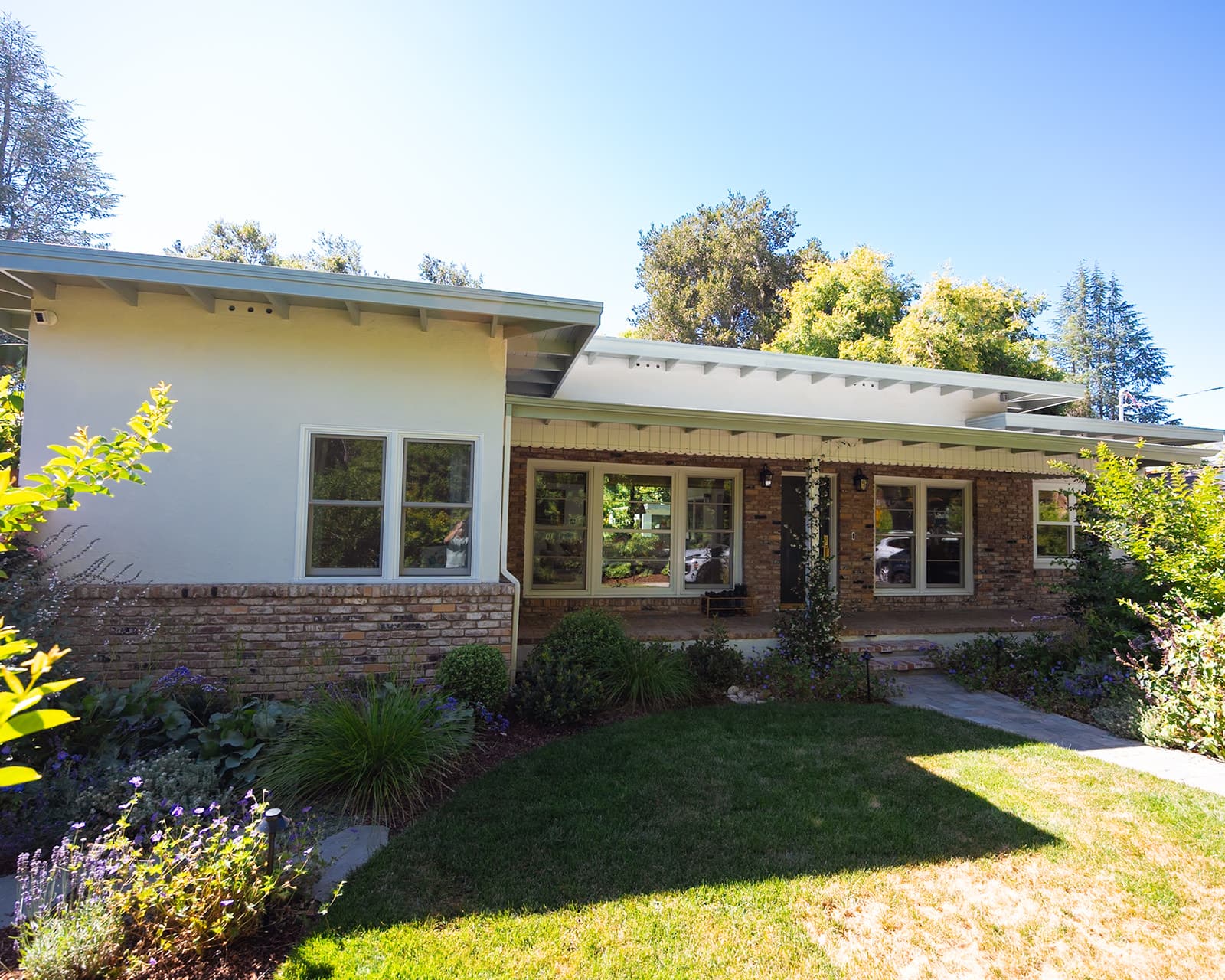 Front elevation of a Menlo Park whole-house remodel with brick and board-and-batten siding